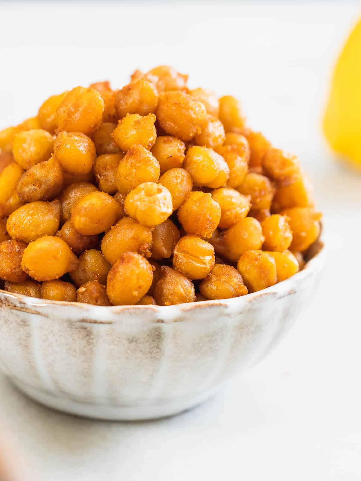 spicy roasted chickpeas served on a small bowl.