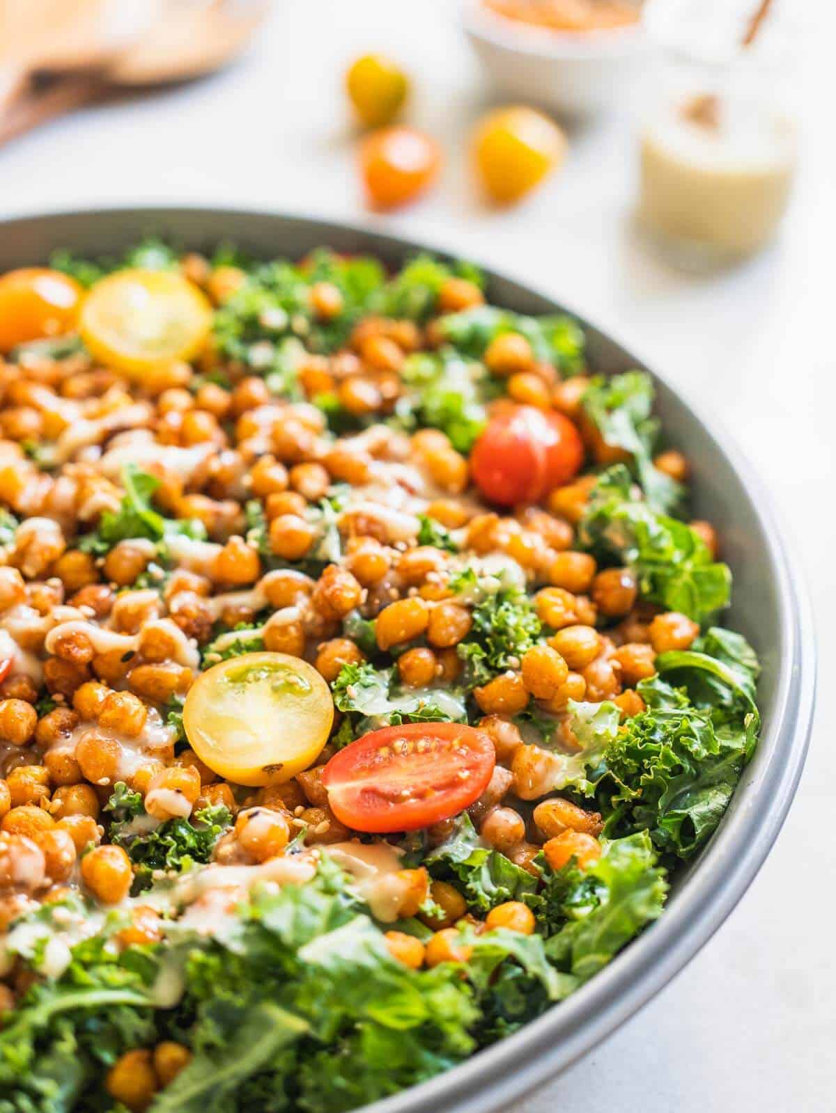 crispy chickpea and kale salad drizzled with tahini dressing.