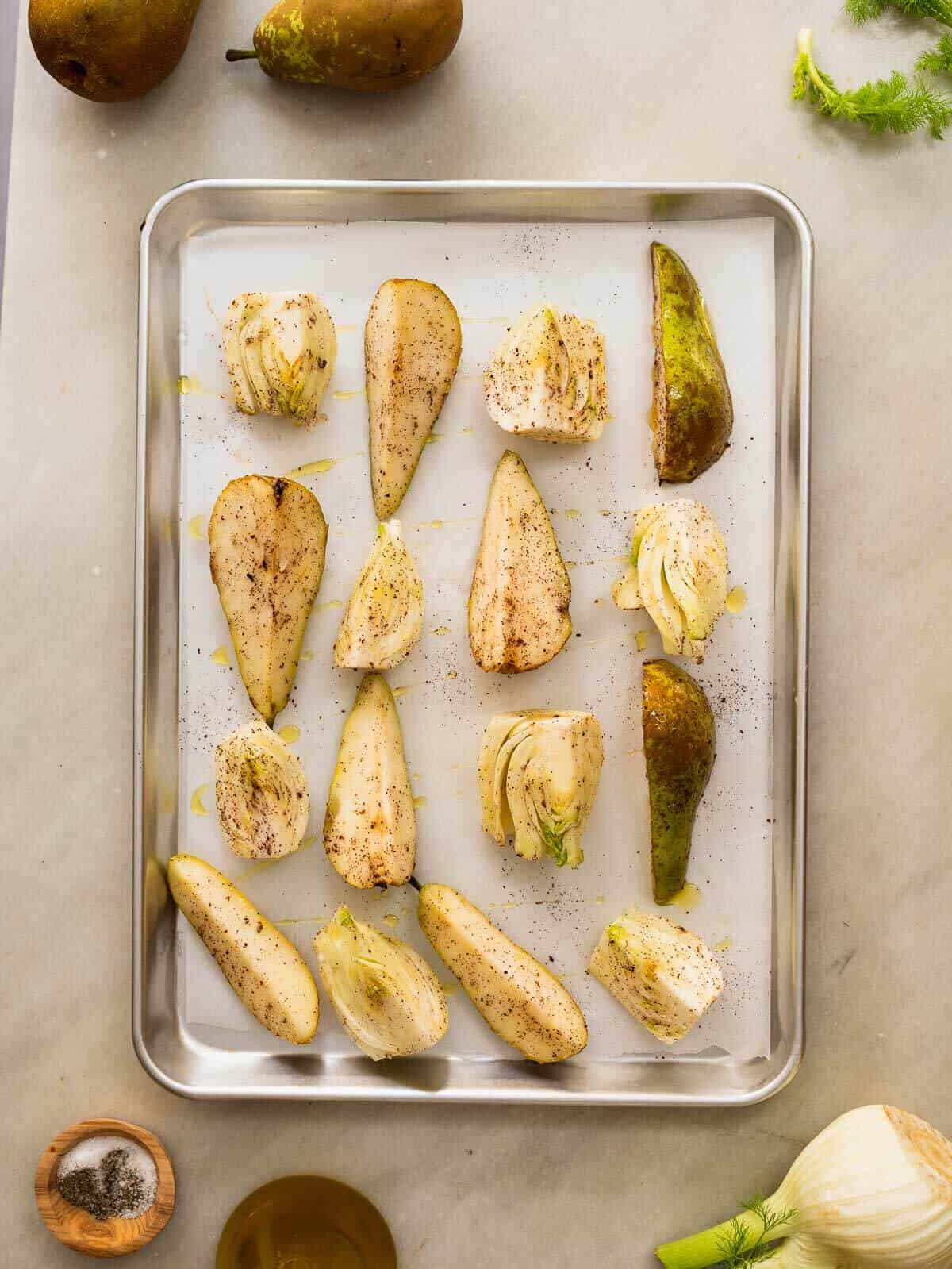 baking sheet with pear and fennel slices.