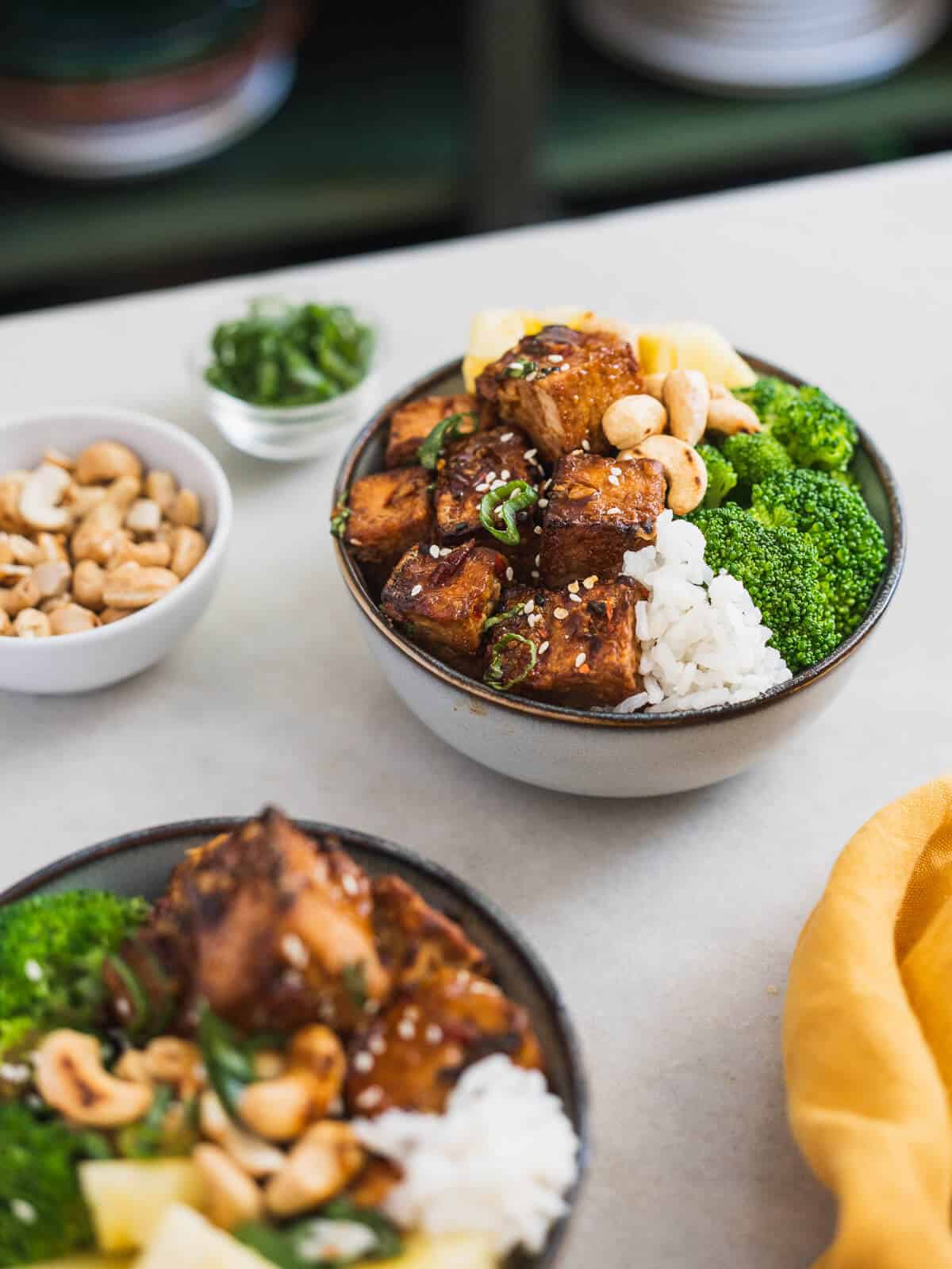 assembling the tofu rice bowl.