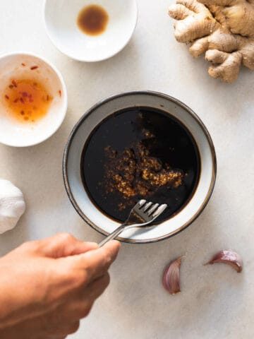 stirring all ingredients of the marinade in a bowl.