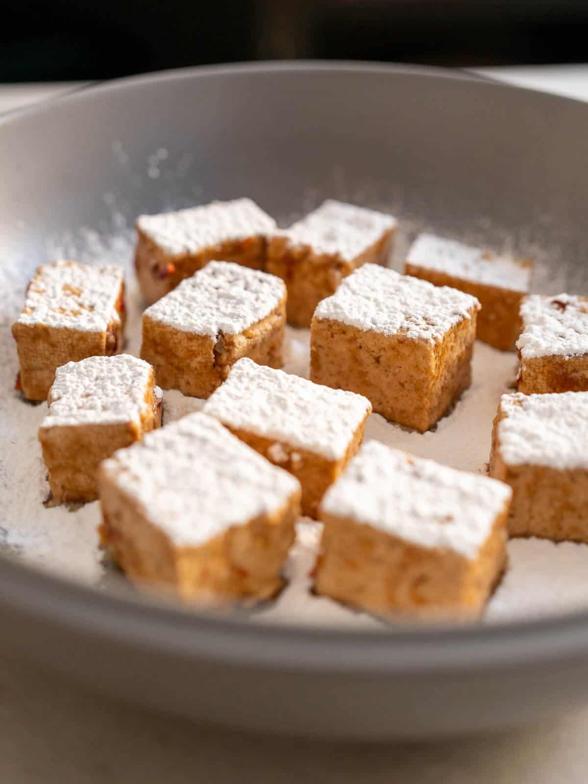 perfectly coated with cornstarch tofu puffs.
