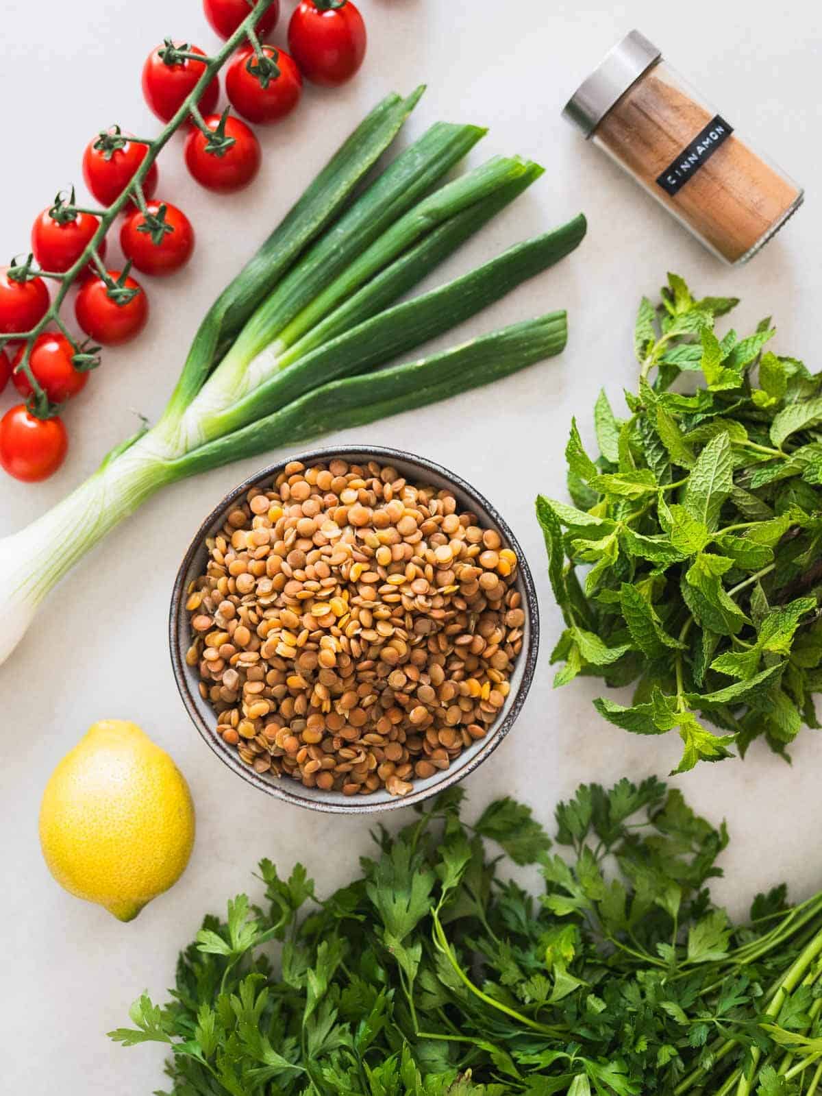 ingredients to make a green lentil tabbouleh saald.