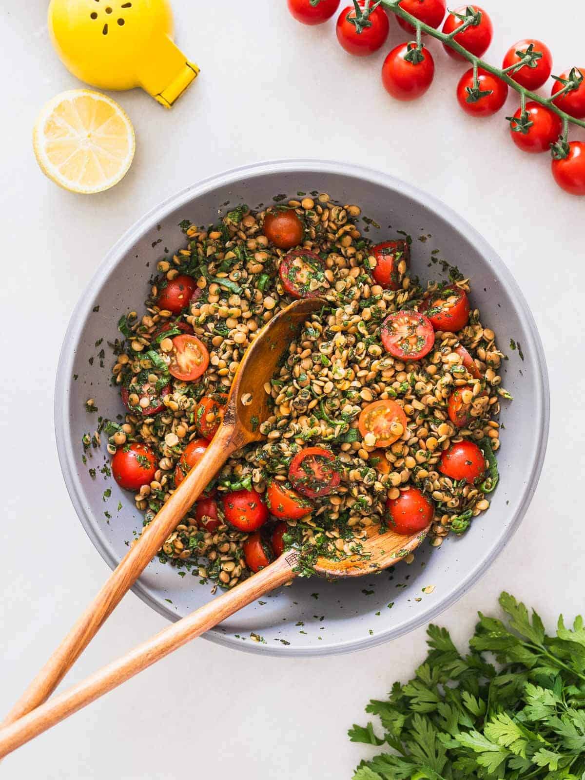 combining all the green tabbouleh salad ingredients in a large bowl.