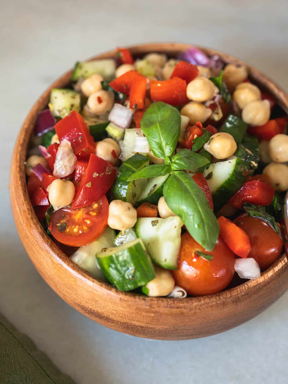 bowl of chickpea cucumber salad representing green Mediterranean diet.