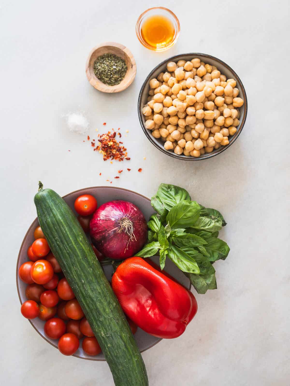 ingredients to make mediterranean chickpea cucumber salad.