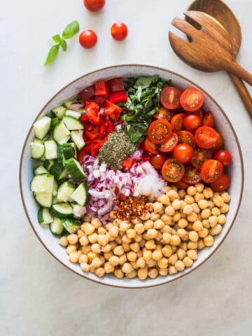 all the ingredients of the salad in a bowl previous to combining them.