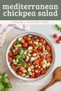 mediterranean chickpea cucumber salad in a serving bowl pin.