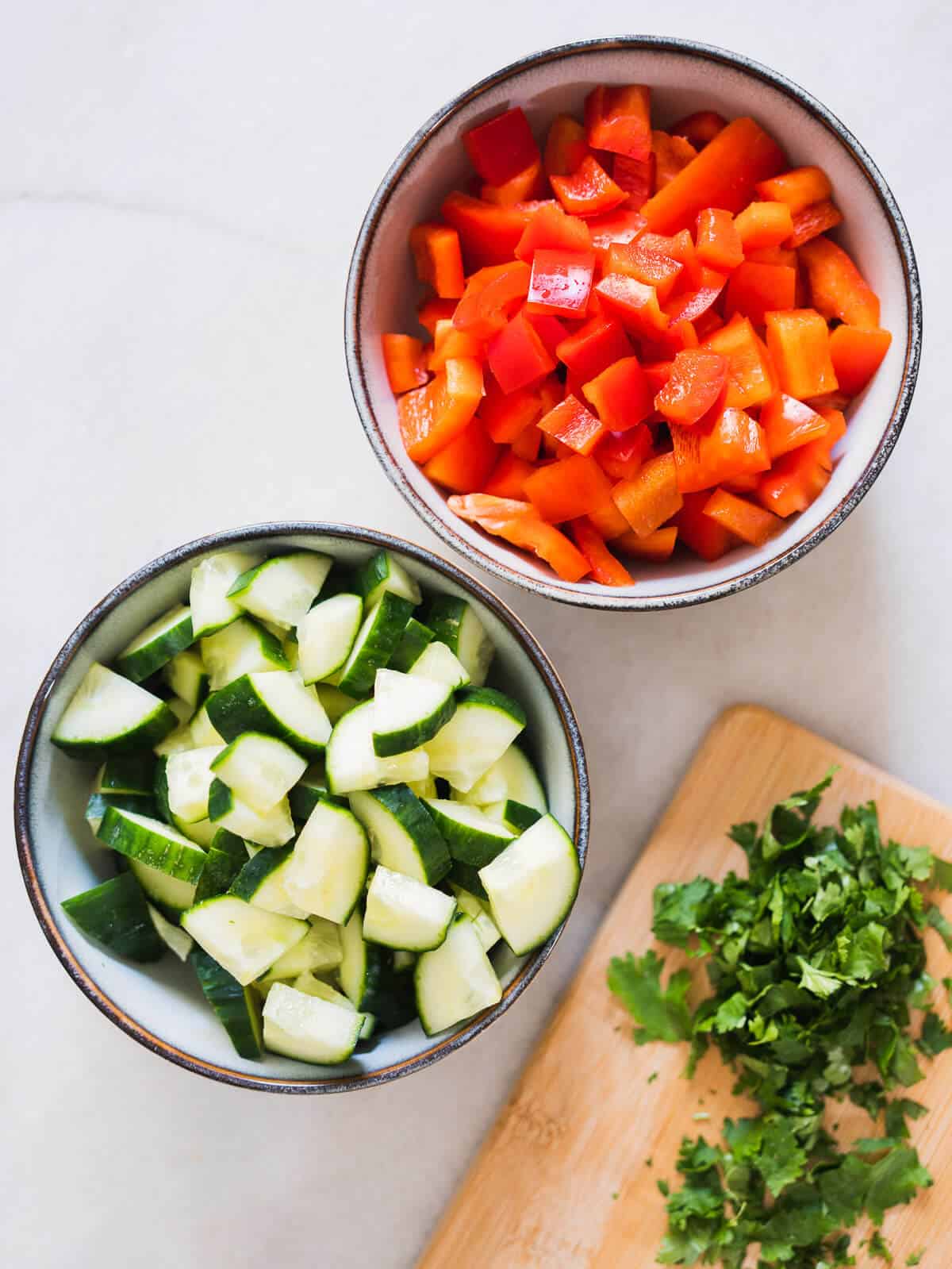chopped red bell pepper, cucumber, and cilantro leaves.