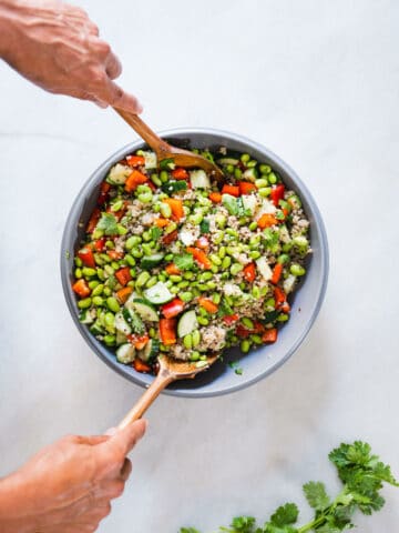 combine all the chopped vegetables with the cooked quinoa and shelled edamame beans.