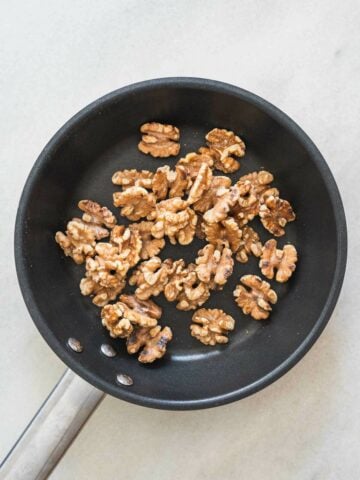 toasting walnuts in a skillet.