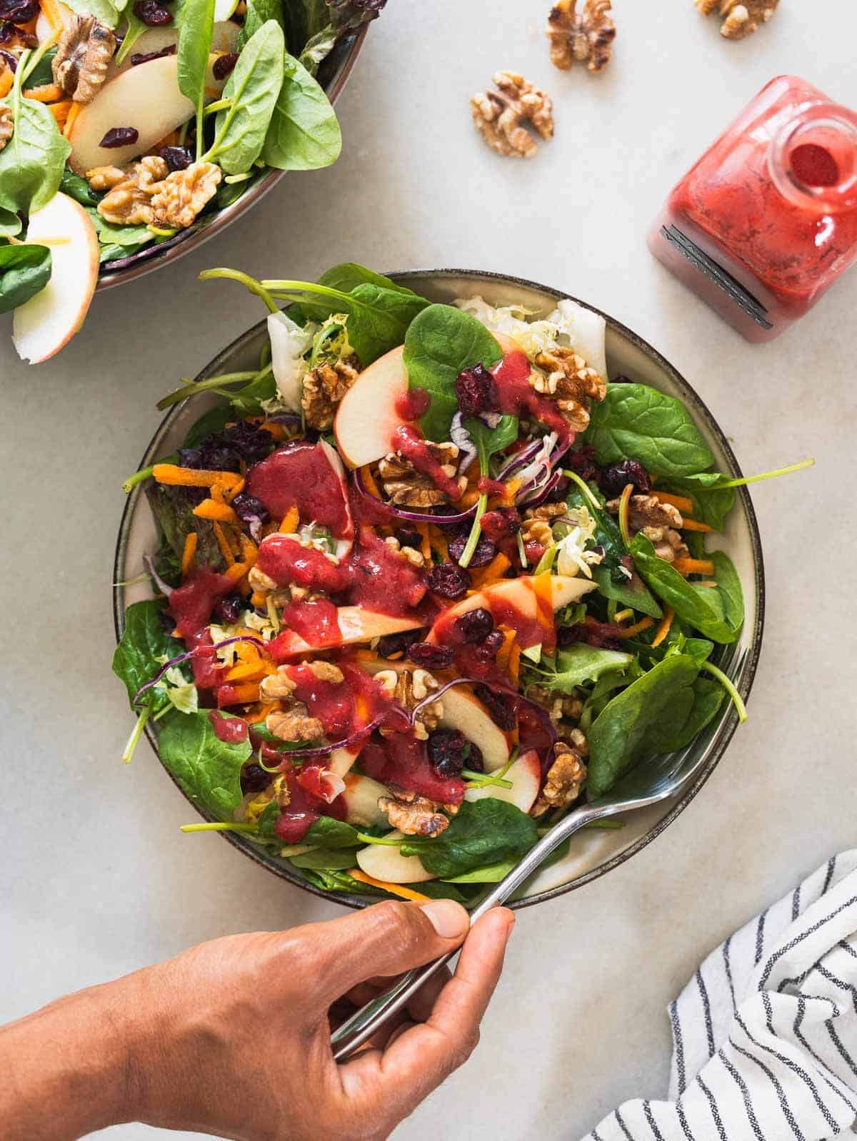 dress the apple spinach salad with the raspberry dressing.