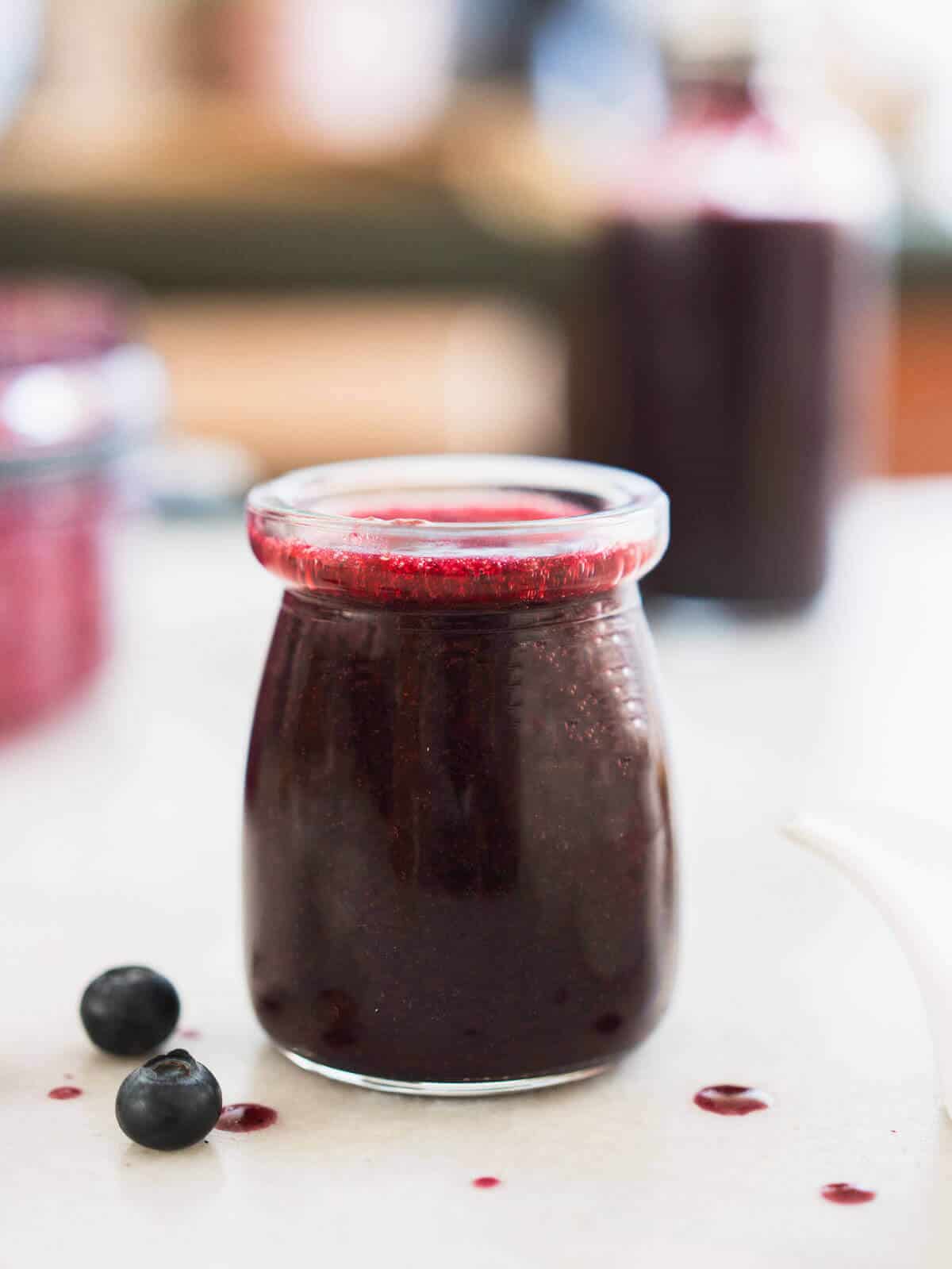 balsamic blueberry salad dressing in a small glass bottle.