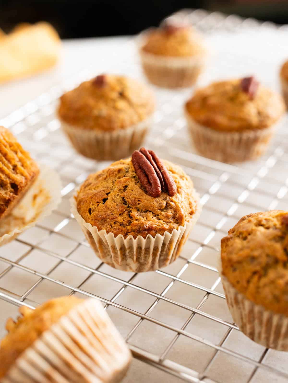carrot banana muffins in a cooling wire rack.
