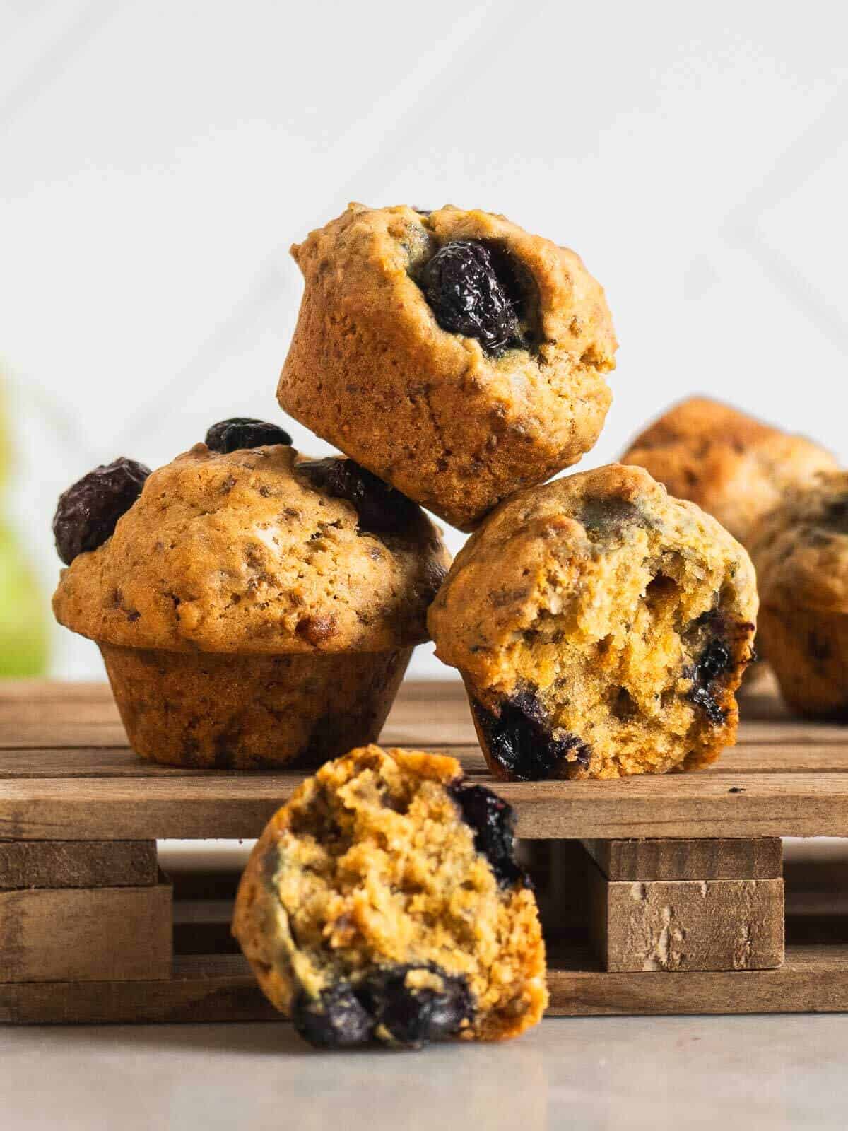piled mini blueberry muffins.