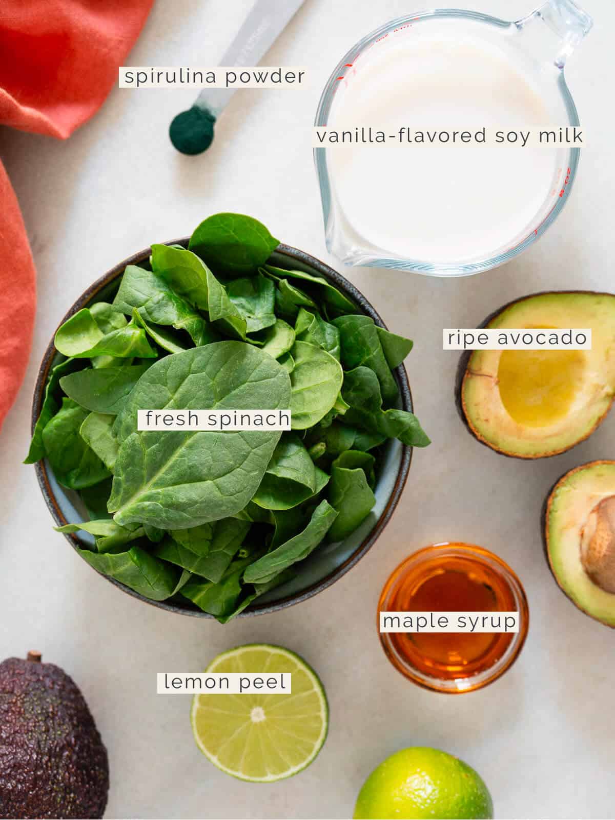 ingredients to make green smoothie recipe with avocado.