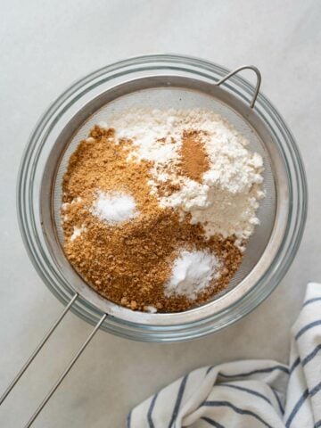 add all the dry ingredients to a colander placed on top of a colander.