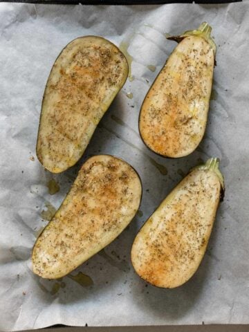 rub eggplants with herbs and spices mixture and drizzle eggplant with olive oil.