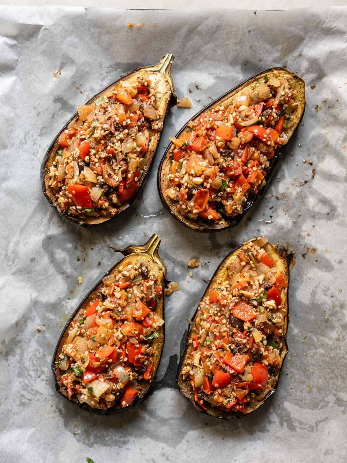 add the stuffing to the roasted eggplant boats.
