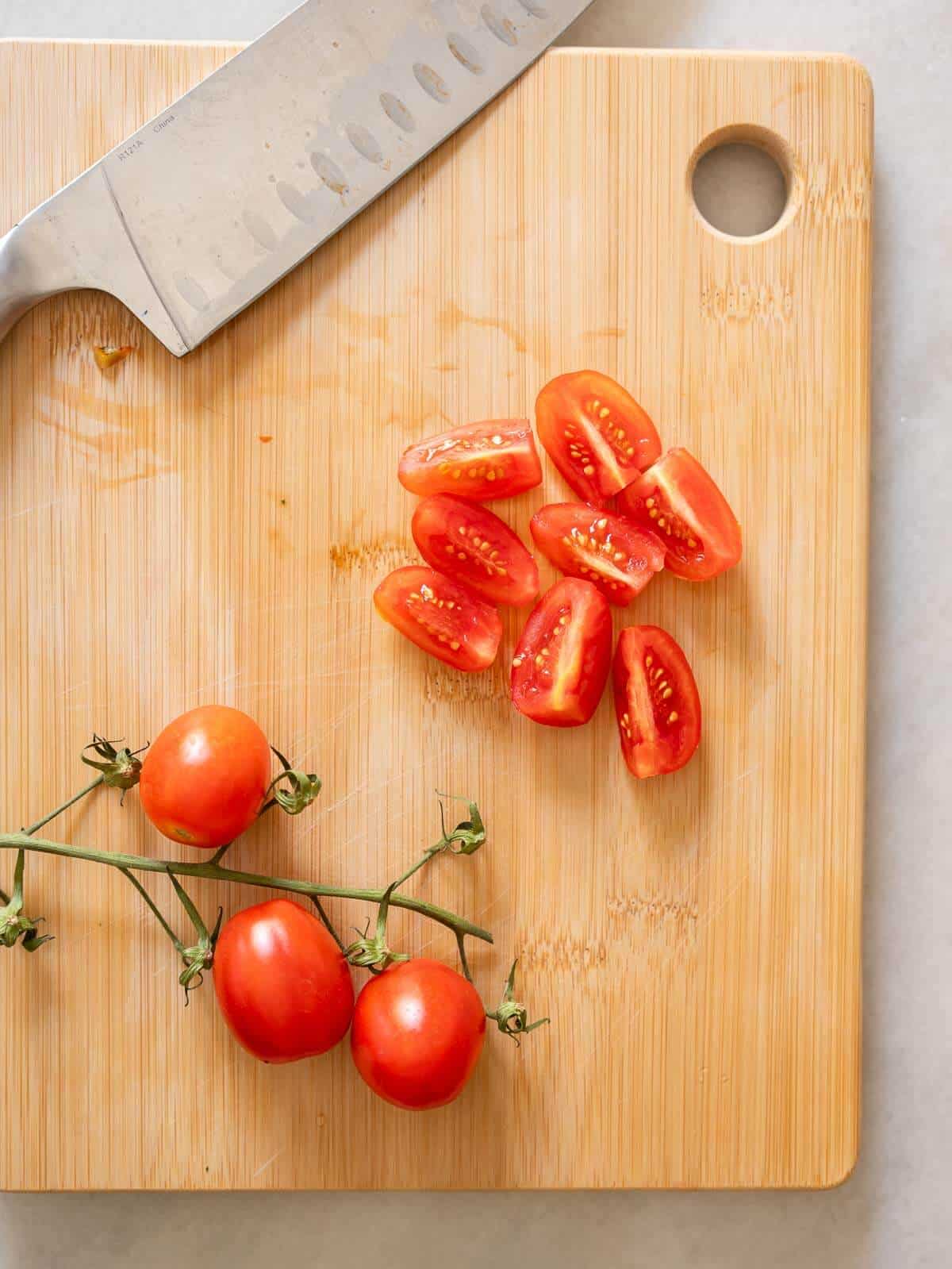 quartered grape tomatoes.