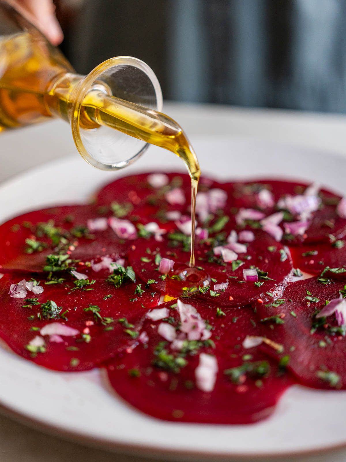 add oil to the carpaccio of beets.