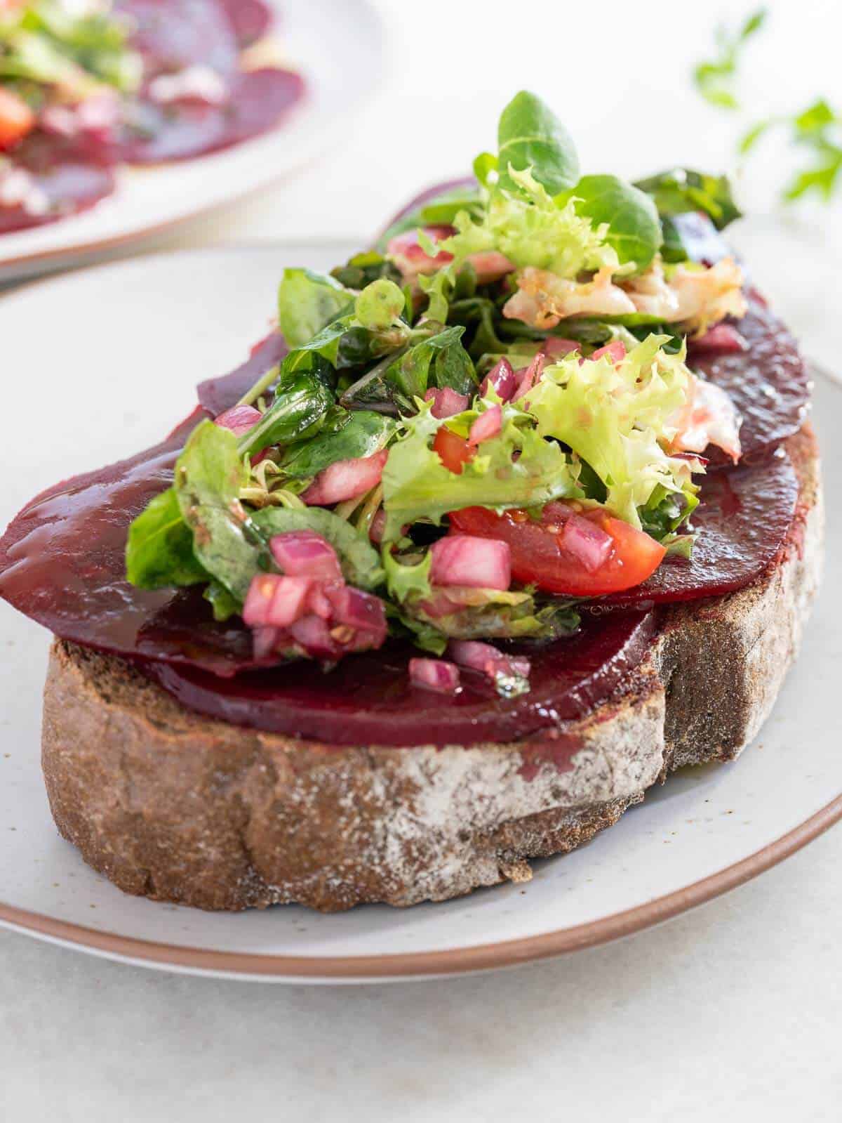 add carpaccio of beets on top of a lice of toasted artisan Italian bread.