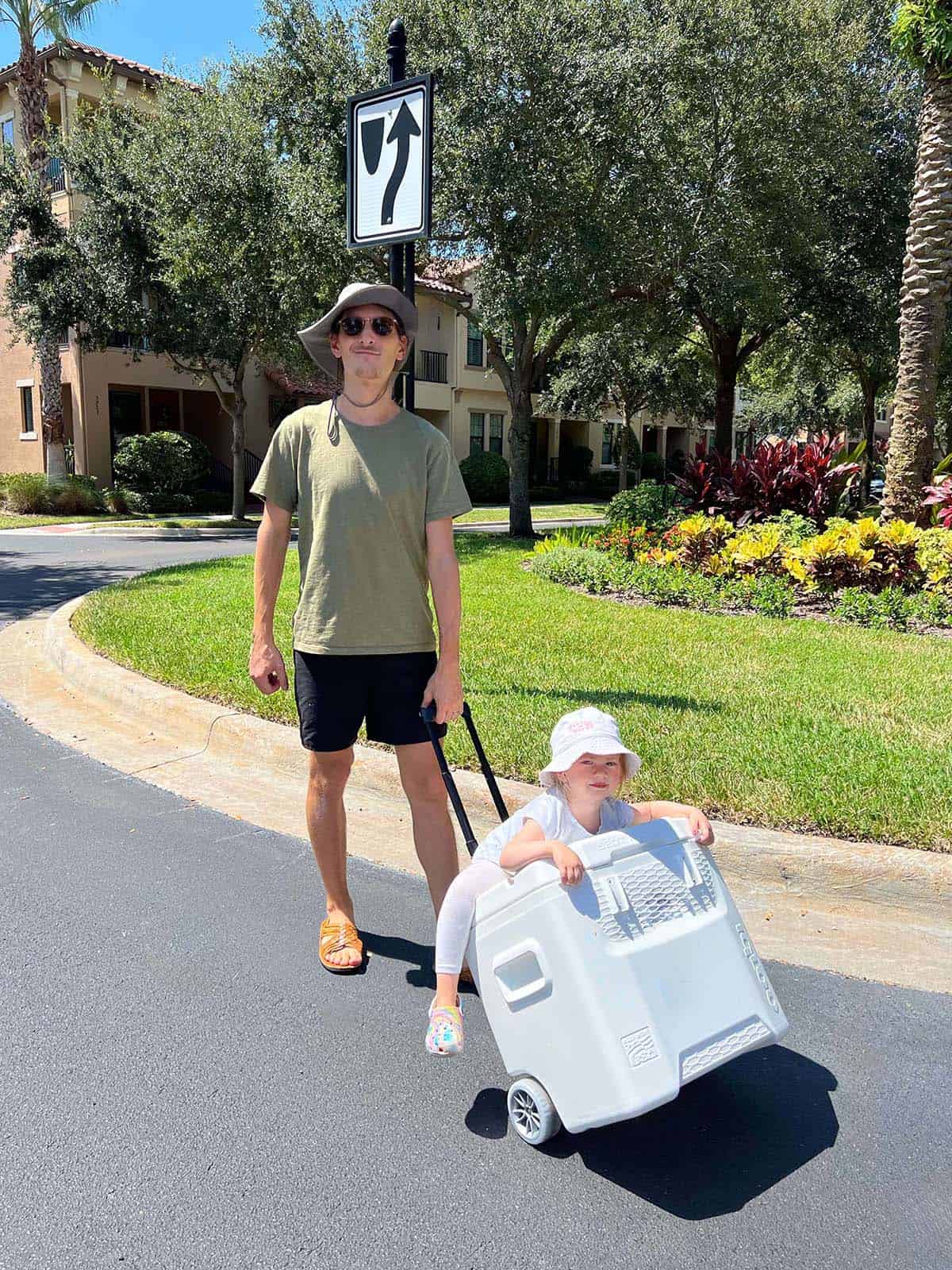 Joaquin with kid in the cooler stroller.