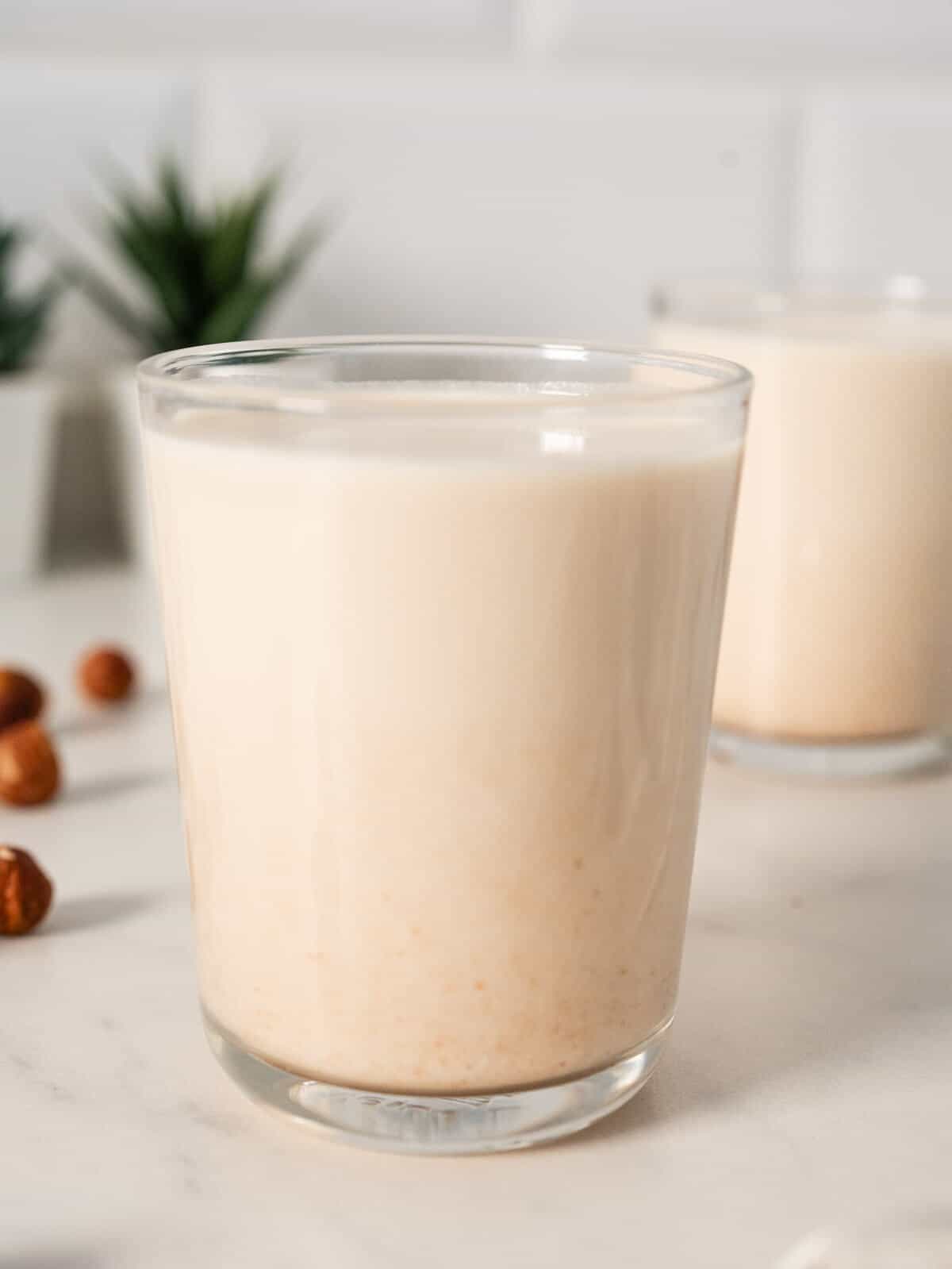 glass of homemade hazelnut milk.