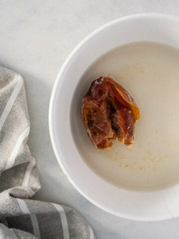 soaking dates to optionally sweeten hazelnut milk.