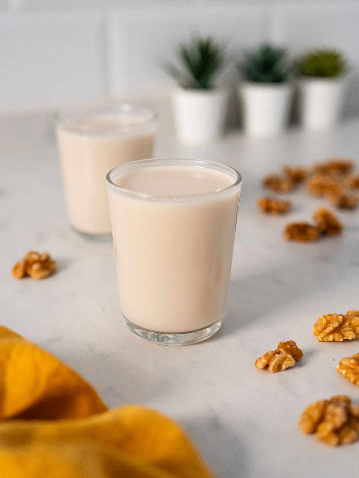 two glasses of homemade walnut milk.