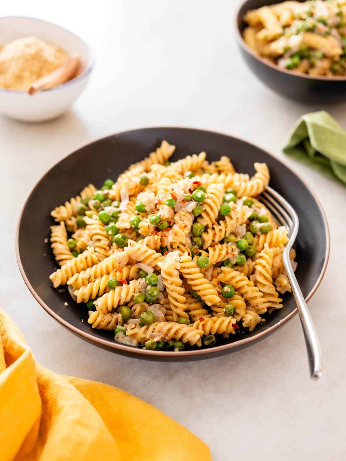 Italian peas and pasta Recipe served with red pepper flakes.