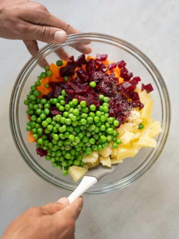 combine the diced ingredients, salt, and green peas in a bowl.