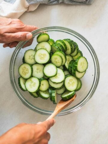 place slides in a bowl and add salt and rice vinegar.