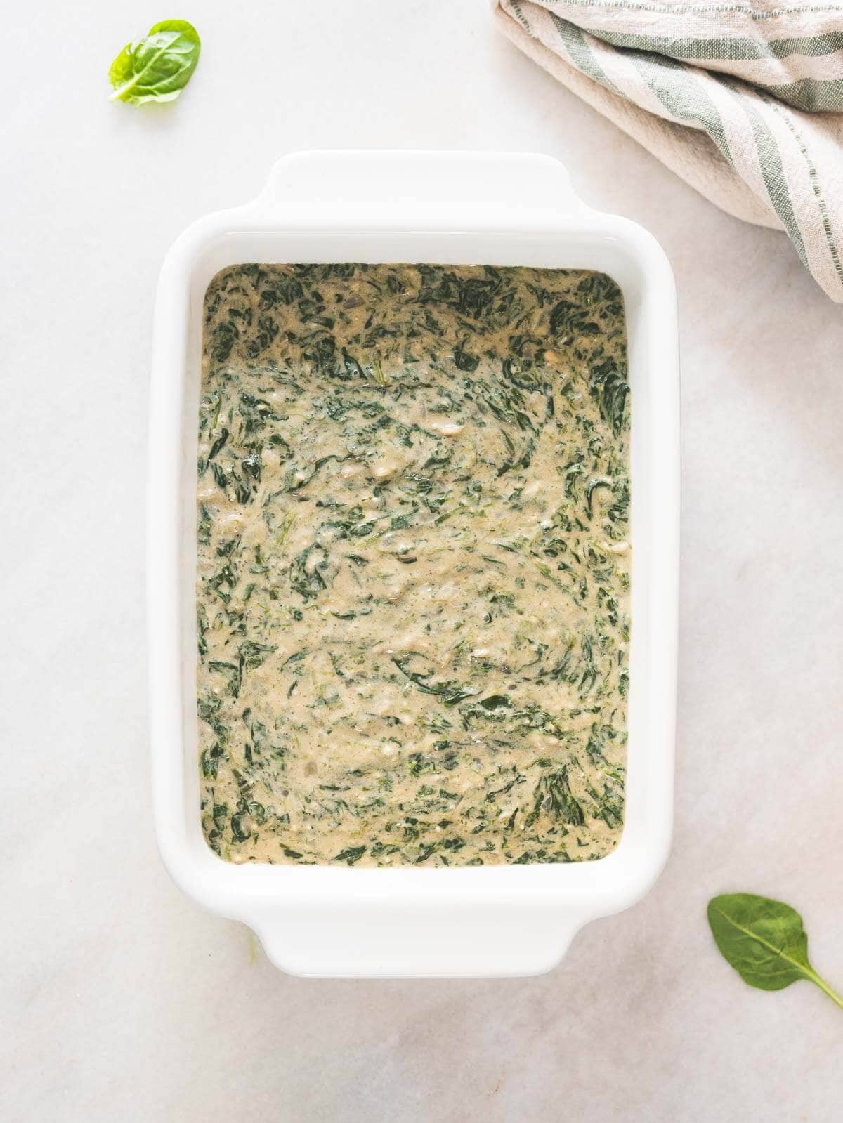 pour the spinach cream sauce into a baking dish.