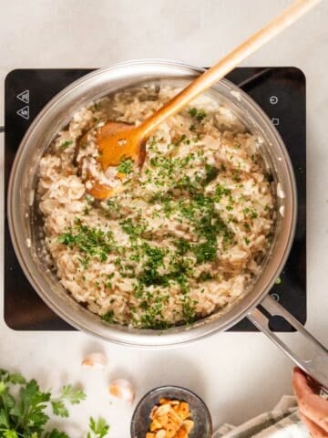 stirring in parsley to the risotto.