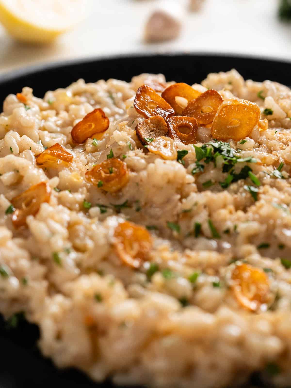 add toasted garlic flakes on top of the garlic risotto to garnish.