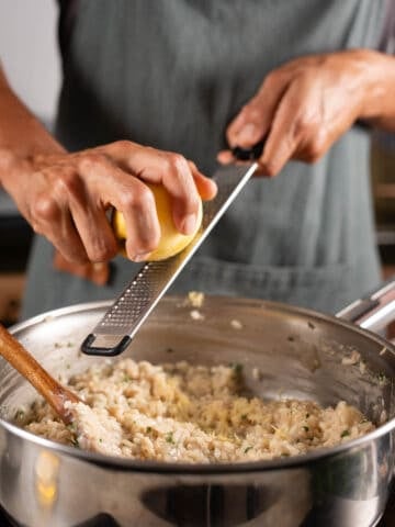 zest lemon on top of the garlic risotto.