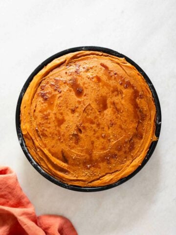 baked sweet potato pudding in baking dish.