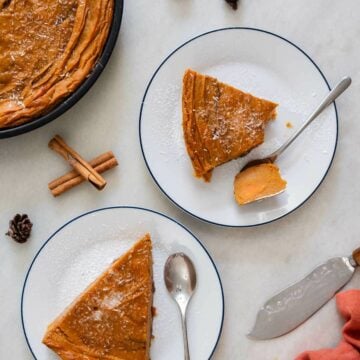 portions of Jamaican sweet potato pudding cake served in dessert dishes.