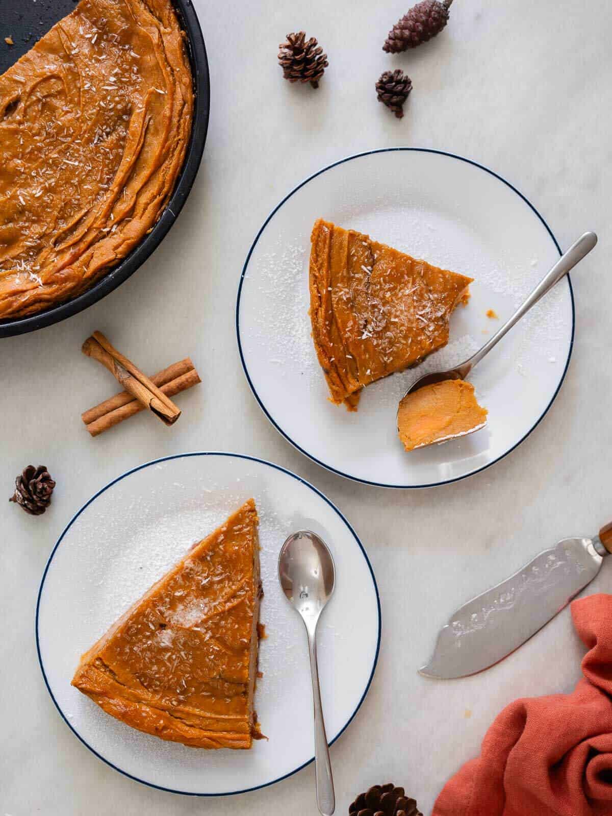 portions of Jamaican sweet potato pudding cake served in dessert dishes.