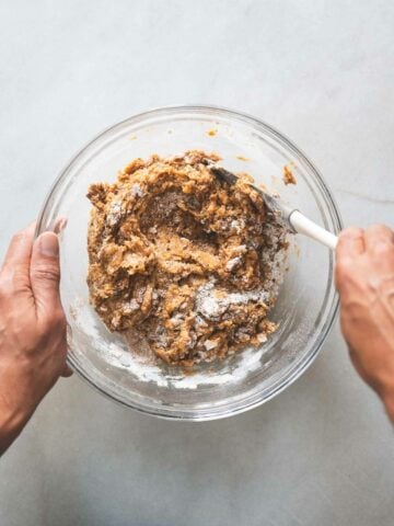 fold together all wet and dry ingredients with a spatula until no white spots are left.