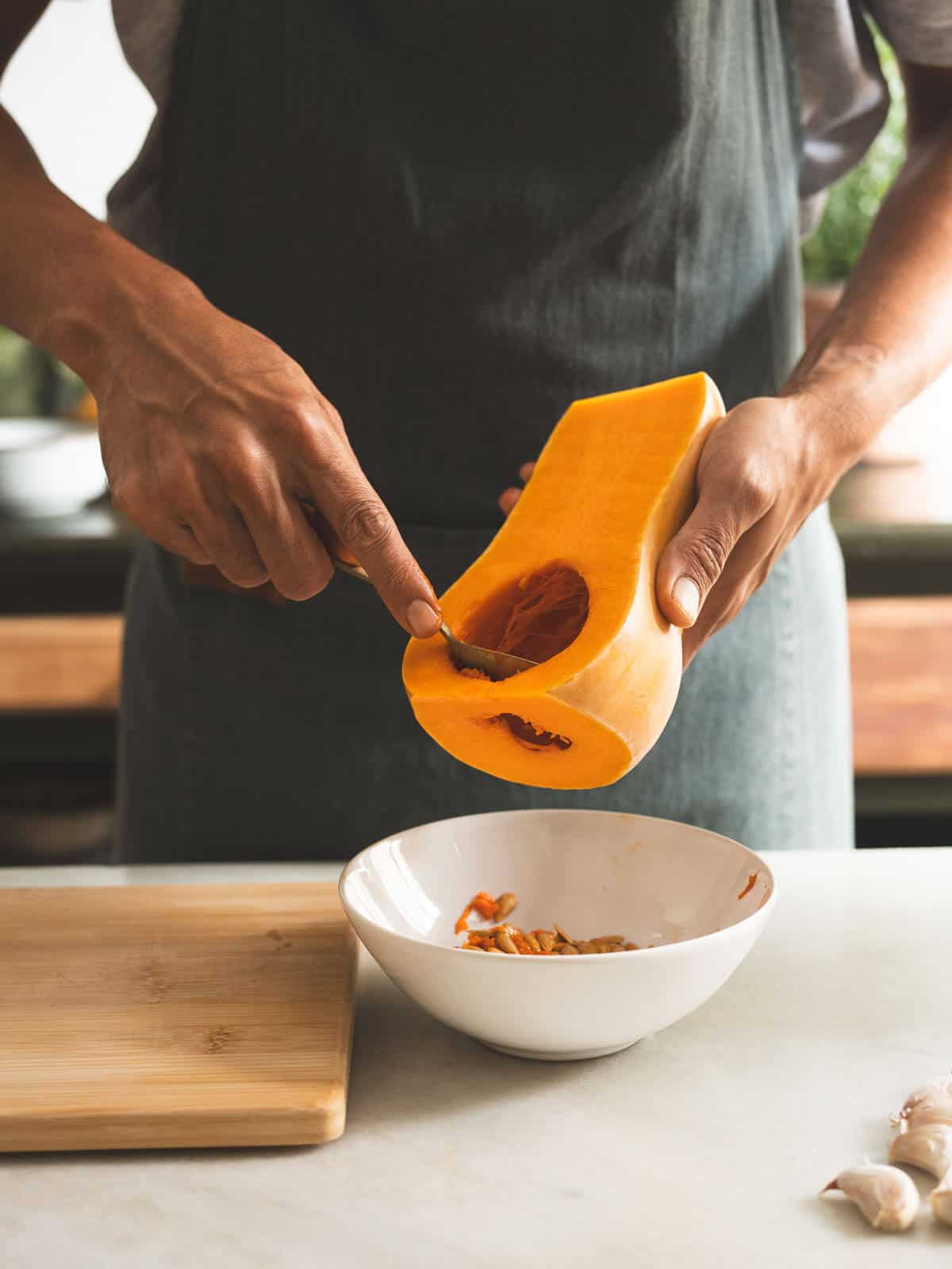 scoop out the seeds of the butternut squash.