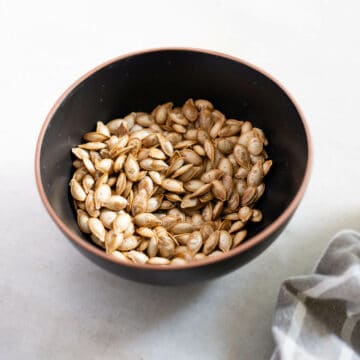 roasted squash seeds in a bowl.