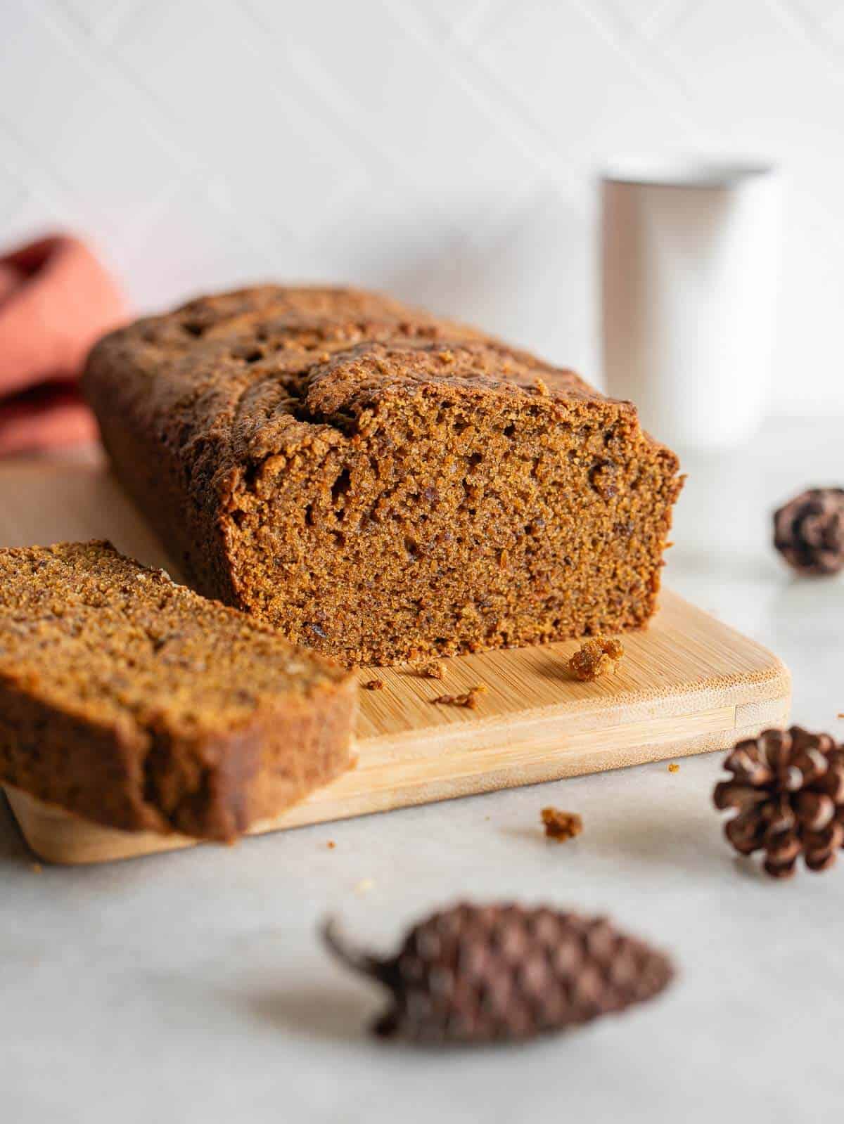 sweet potato loaf cake on a wooden table and sliced.