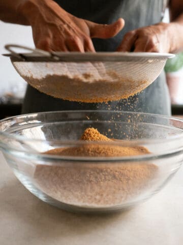 sifting coconut sugar.