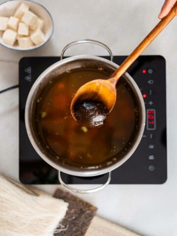 Toss in carrots, ginger, and tofu. Sauté for an extra 3 minutes, and add the miso paste.