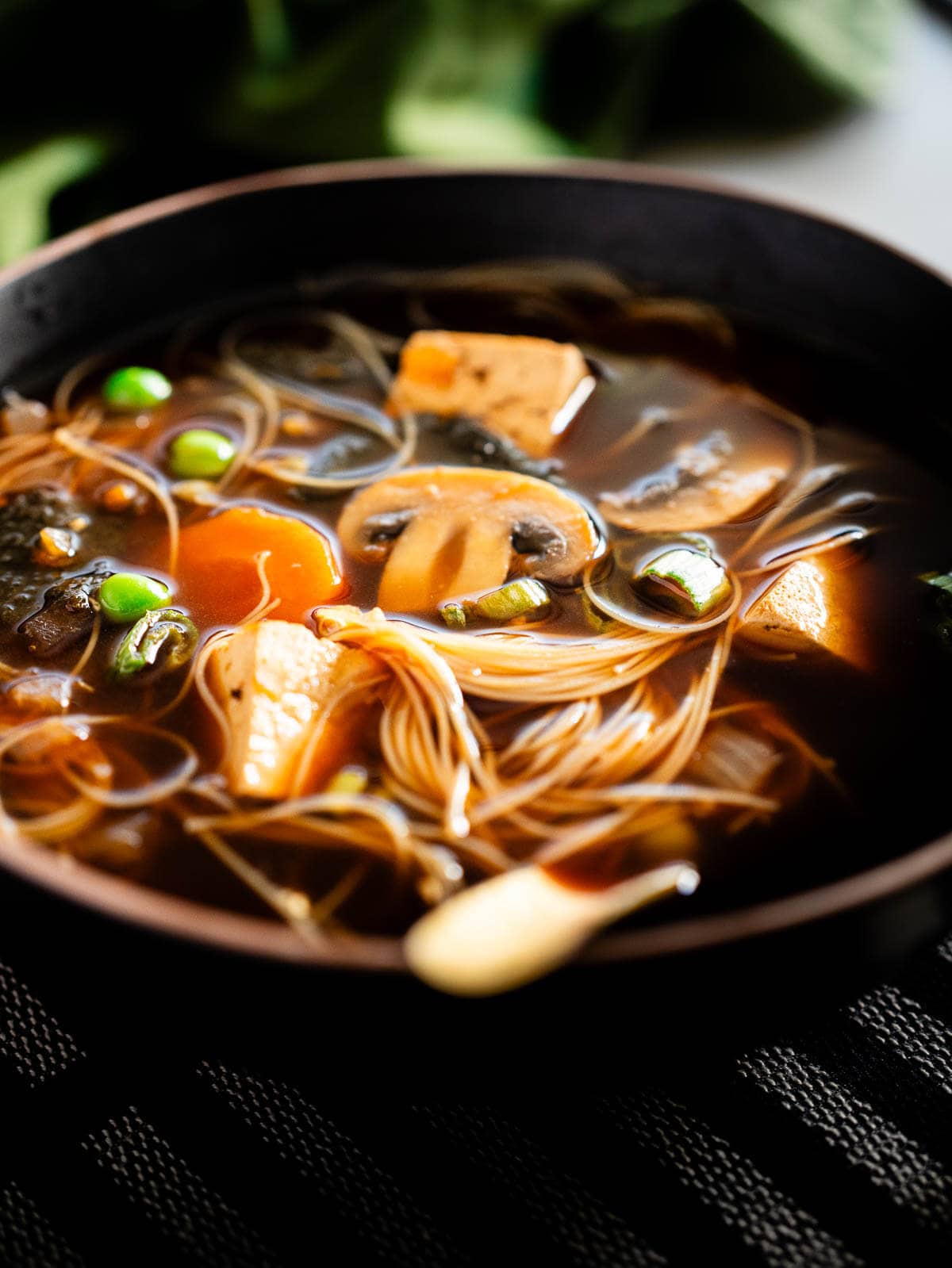 served plate of miso soup with tofu.