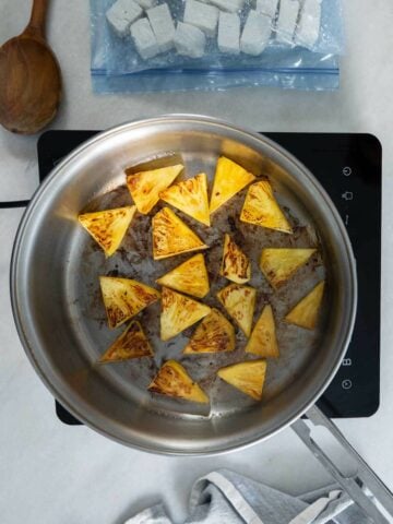 Sear the other half of the pineapple chunks in a skillet.