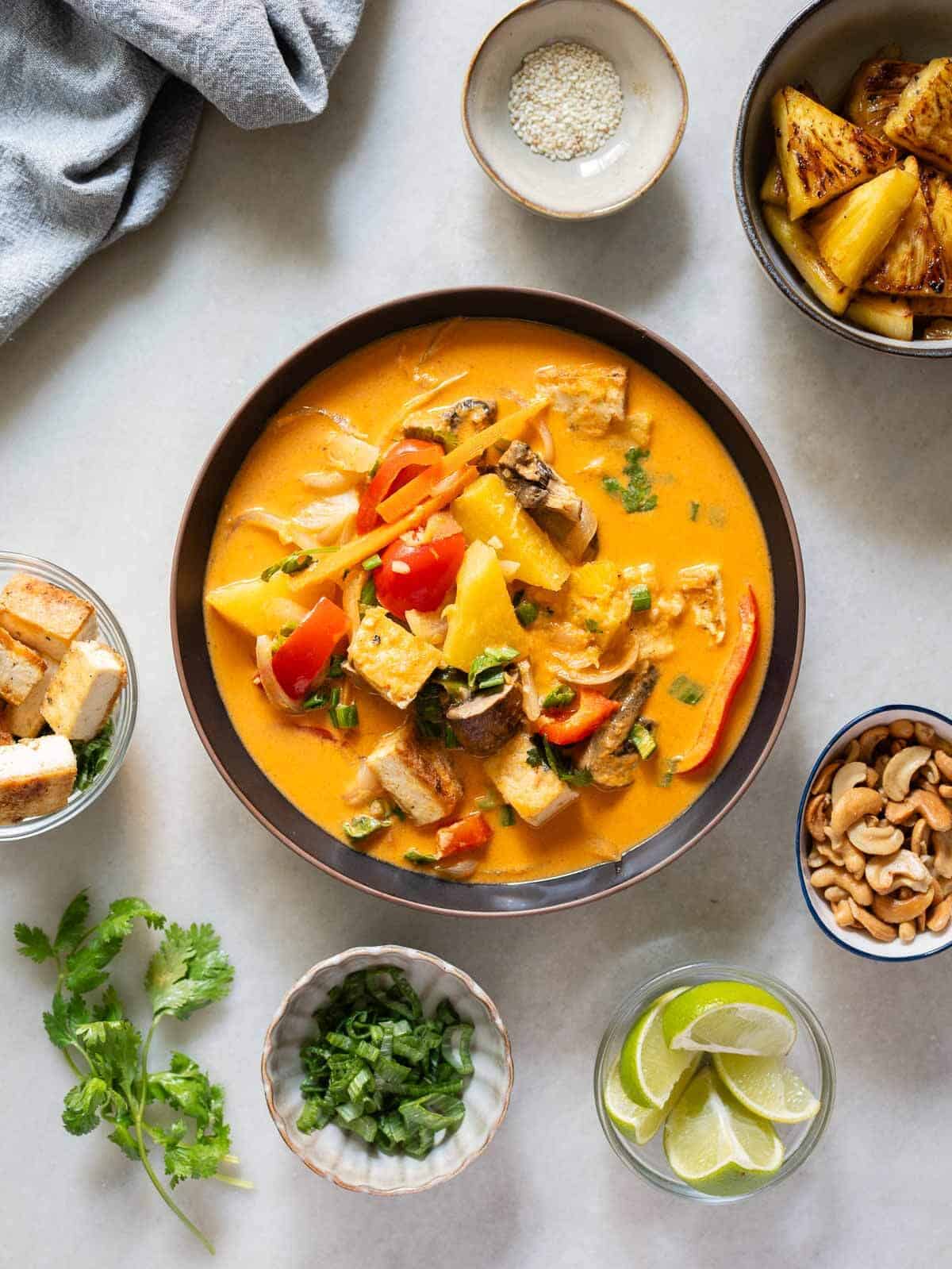 serve curry on a bowl and top wit your prefered garnishing ingredients like cashews, cilantro, lime juice, chopped green onions, and sesame seeds.