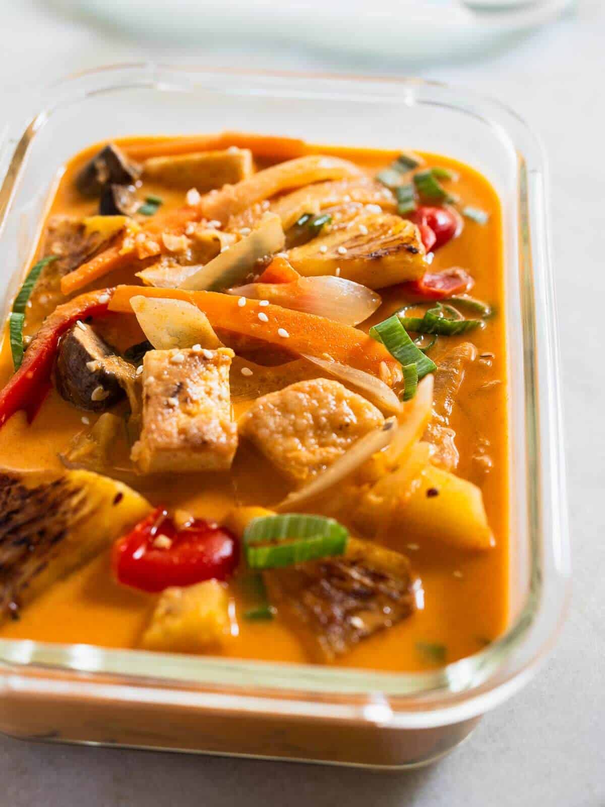 Pineapple Thai Curry stored in an airtight container.